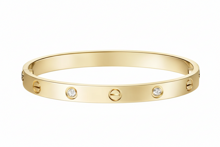 Gold bracelet with diamonds on a light gray background